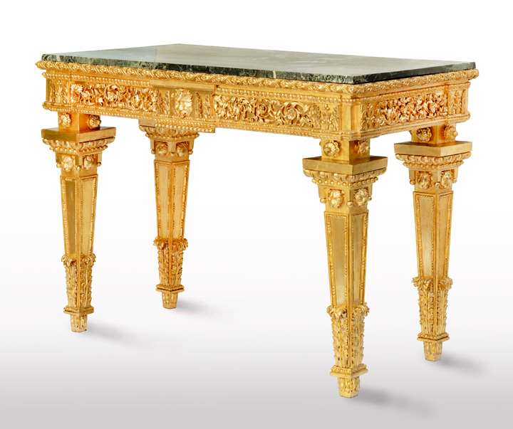 An Italian neoclassical carved and gilded wood console table, with a rectangular Verde Alpi marble top.
